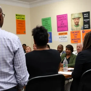 People at a community meeting in New Orleans about sex work legislation