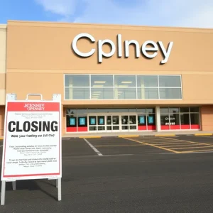 Exterior view of a JCPenney store with a closing sign