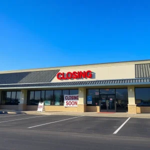 Closed JCPenney store with signage
