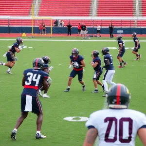 Players in practice uniforms competing during a training session on a football field.
